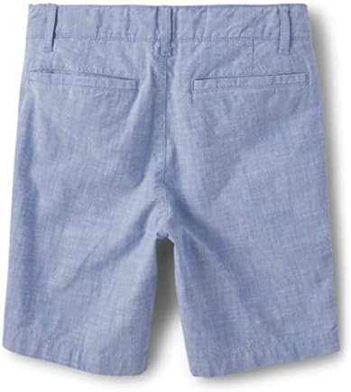 As calças chino de algodão dos meninos do lugar infantil