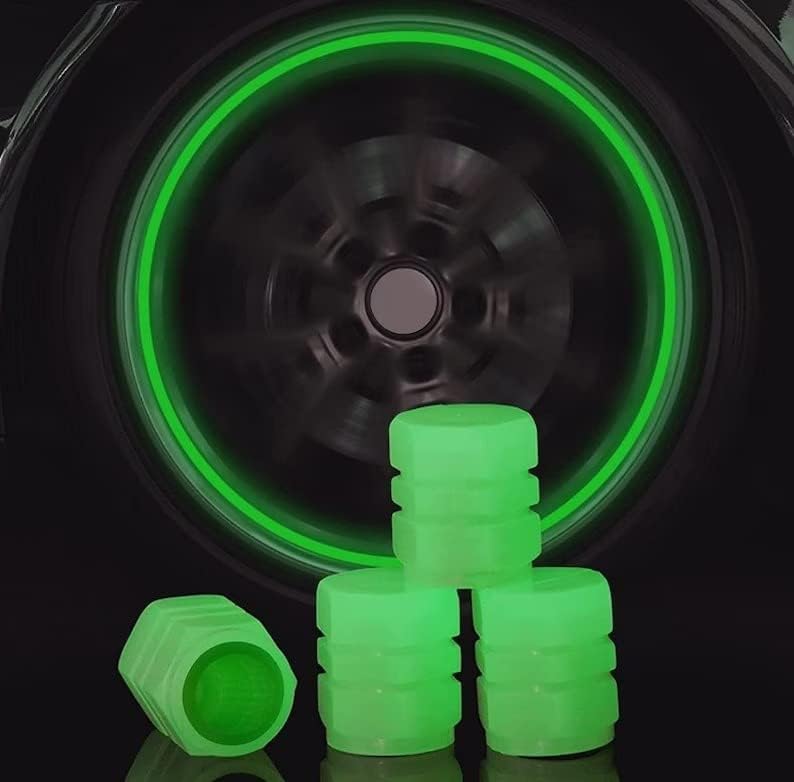 Capas de haste da válvula brilho verde fluorescente no pneu escuro.