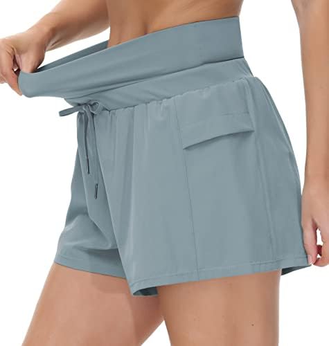 A academia de shorts de treino feminino com linear de malha de cordão de cordão alta e bolsos laterais